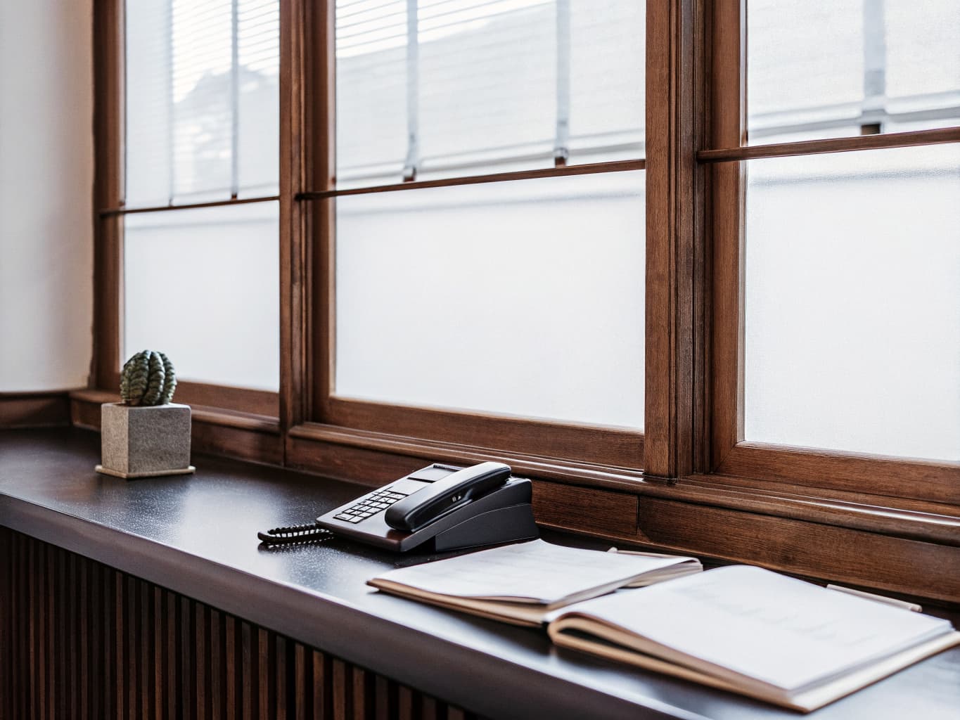 Professional office setting with phone and appointment book