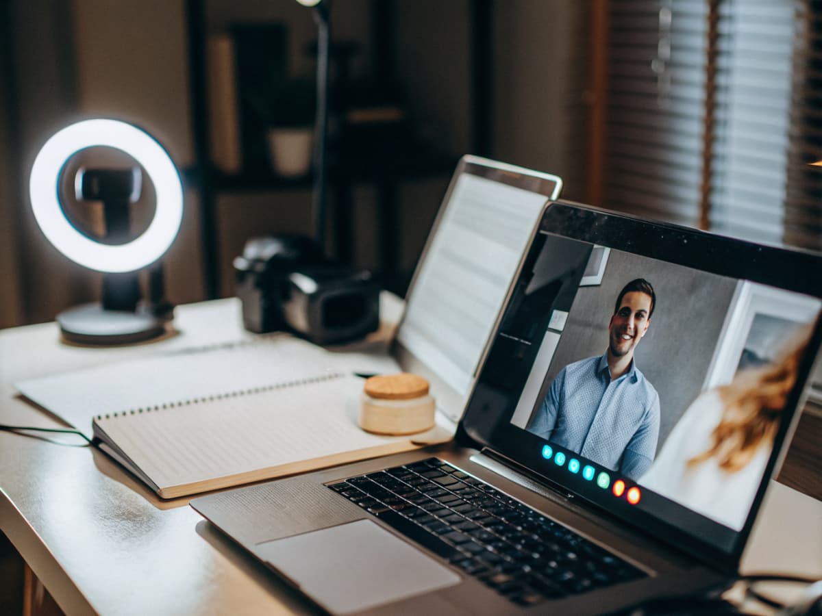 Laptop with ring light setup for remote video notarization